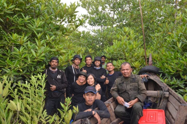 In the jungle, GMT and YAGASU officers, along with local teams, take a group photo after completing a thorough field inventory in two phases